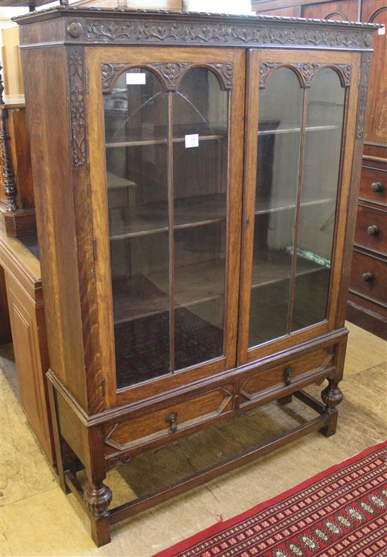 Carved oak glazed bookcase